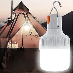 an image of a light that is on top of a table with a tent in the background