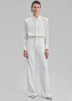 Color: Ivory Midweight woven fabric Regular fit Slightly flared leg Side seam pockets Back welt pockets Belt loops Zip fly Hook and bar closure Unlined 95% Polyester 5% Elastane Hand Wash in Cold Water By The Frankie Shop Classic Trousers, The Frankie Shop, Frankie Shop, Mini Short, Midi Skirts, Pocket Belt, Flared Pants, Color Ivory, Minimal Fashion