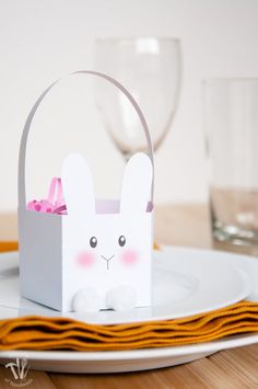 Give your favorite treats this Easter in these easy bunny easter baskets made from paper. Each paper Easter Basket prints on one sheet of cardstock.Assembly easily with hot glue, and add pom-poms for feet and a tail. Detailed assembly instructions can be found here: https://craftingmyhome.com/bunny-easter-basket/  Incl Easter Basket Printable, Easter Basket Template, Paper Easter Basket, Easter Treat Box, Easter Bunny Basket, Easter Printables Free, Basket Crafts, Bunny Basket, Easter Basket Diy