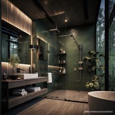 a modern bathroom with green walls and wood flooring is pictured in this image, there are plants on the shelves next to the shower