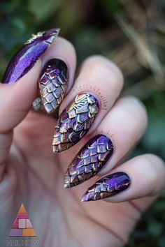 Unleash your inner dragon with these stunning purple nails acrylic, featuring a metallic purple and gold design that mimics dragon scales. Perfect for those who love bold, fantasy-inspired purple nail designs, these nails are a true statement piece. Explore more fierce styles at nailhow.com! Nails Dragon Design, Dragon Egg Nails, Purple Lace Nails, Purple Cartoon Nails, Dragon Scale Nails Designs, Dragon Scales Nails, Dragon Skin Nails, Dungeons And Dragons Nail Art, Dnd Nail Designs