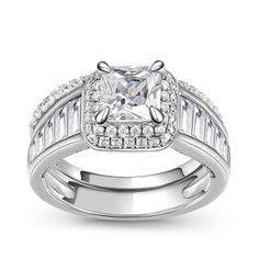 Stunning and sparkling, this ring set will capture her heart at first sight. Crafted in sterling silver, the engagement ring features a glistening round-cut center stone wrapped in a shimmering halo. The ring's shank is set with additional stones and adorned with milgrain detailing for extra elegance and sparkle. On your wedding day, speak your vows as you slip the coordinating wedding band on her waiting finger.Carat Weight: 2.5 ctStone Size: 7 mmStone Type: Jeulia® StoneNumber of Stones: 1 Stone Color: Diamond WhiteStone Shape: RoundCarat Weight: 1.891 ctStone Size: 1.5,1.3,1.2,1.7,1.1 mmStone Type: Jeulia® StoneNumber of Stones: 114 Stone Color: Diamond WhiteStone Shape: RoundWeight: 6.21 gWidth: 9.53 mmHeight: 9.12 mmThickness: 2.8 mmMaterial: 925 SilverPlating Color: Silver Dazzling Silver Bridal Set With 17 Jewels, Wedding Sterling Silver Gemstones With Halo Setting, Dazzling Sterling Silver Bridal Sets For Formal Occasions, Silver Bridal Sets With Brilliant Cut For Formal Occasions, Luxury Sterling Silver Bridal Sets With Brilliant Cut, Sterling Silver Rings Set, Silver Ring Set, Stone Wrapping, Quality Jewelry