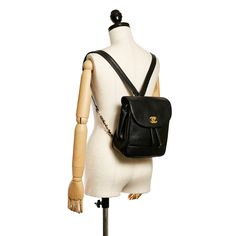 This beautiful Chanel Triple CC backpack has a black caviar leather body with the signature Triple CC stitching along the bottom of the Bag, flat leather straps with gold-tone detailing, a flap with gold-tone interlocking Cs, and a twist closure. The Bag also features a drawstring closure and zippered compartments inside. Gucci Watch, Versace Watch, Gold Chanel, Jimmy Choo Sunglasses, Chanel Caviar, Fendi Shoes, Black Caviar, Sunglasses Branding, Gucci Shoes