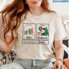 a woman wearing a t - shirt that says first then data christmas