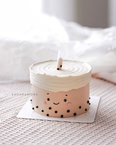 a cupcake with a candle sticking out of it sitting on top of a napkin