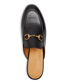 With its classic almond toe, soft, sumptuous leather, and gold-tone horsebit, the Gucci Princetown mule goes equally well with tailored suits, separates and your favorite jeans and tee. Gucci Shoes Women, Flat Slipper, Buy Gucci, Leather Mules, Gucci Mules, Gucci Shoes, Leather Flats, Mules Shoes, Favorite Jeans