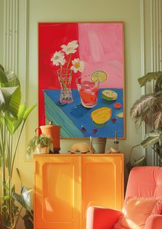 an orange chair in front of a painting on the wall and potted plant next to it