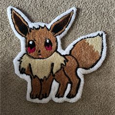 a patch with a small cartoon animal on it's back and the words pokemon written in