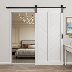 an open white door leading to a bedroom with a bed and desk in the background