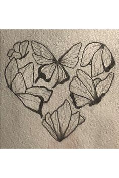 a drawing of butterflies in the shape of a heart with leaves on it's side