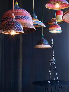 an assortment of multicolored lamps hanging from the ceiling