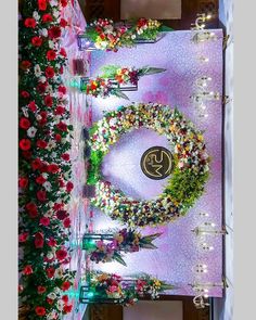 an overhead view of a decorated stage with flowers on it