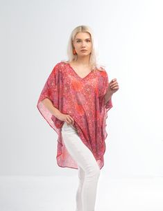 MANDALA Top Small / Medium The mandala print chiffon fabric on this top is a sure standout for spring or winter getaways. Made from a linen blend fabric, it’s light and airy. Layer it over a tee, tank or swimsuit for an added touch of glamour. Lightweight woven textured Chiffon fabric Curved Hemline Vneckline Small / Medium Wear as a top or a coverup Lurex striping detail in the fabric 100% polyester. Imported. This wrap typically ships within 1 to 2 days. Shop Great Gifts at MainStreet Mercanti Flowy Floral Print Tunic Top, Pink V-neck Top For Beach Cover-up, Pink V-neck Beach Cover-up Top, Pink Bohemian Blouse With Vibrant Print, Bohemian Pink Blouse With Vibrant Print, Flowy Bohemian Blouse With Vibrant Print, Red Paisley Print Top For Vacation, Summer Red Blouse With Paisley Print, Pink Boho Print Festival Top