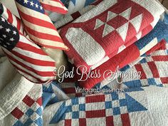 an american flag quilt and pillows on top of a bed with the words god bless america