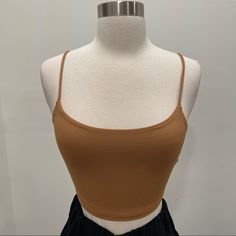 Brand New With Tags. Adjustable Spaghetti Strap Crop Top. Brown Casual Camisole With Spaghetti Straps, Trendy Brown Camisole Top, Brown Spaghetti Strap Casual Camisole, Trendy Brown Cami Top, Trendy Brown Cami Tank Top, Brown Spaghetti Strap Camisole, Casual Brown Cami Crop Top, Trendy Seamless Brown Tank Top, Everyday Brown Crop Top