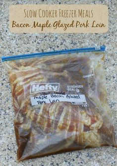 a bag of bacon wrapped in plastic sitting on top of a counter next to a sign that reads slow cooker freeze meals