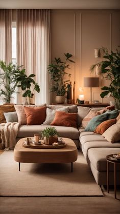 a living room filled with lots of furniture and plants