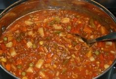 a large pot filled with stew on top of a stove