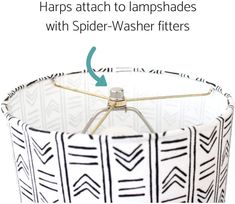 a lamp shade with spider - washer filters on the bottom and an arrow pointing to it