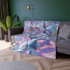 a couch with a blanket on it in a living room