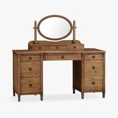 an antique wooden dressing table with mirror