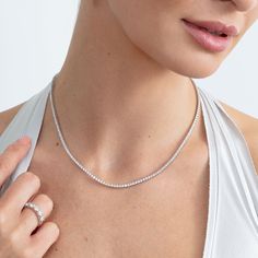 Callie Embrace modern elegance with our Lab Grown Diamond Tennis Necklace. This stunning piece features a continuous line of sparkling lab-grown diamonds, each meticulously set in a sleek and timeless design. Perfect for any occasion, this necklace offers the brilliance of diamonds with an eco-friendly touch. Whether you're dressing up for a special event or adding a touch of luxury to your everyday look, this tennis necklace is a versatile and sophisticated addition to your jewelry collection. Daisy Pendant, Diamond Tennis Necklace, Continuous Line, Tennis Necklace, Handcrafted Necklace, Modern Elegance, Special Event, Everyday Look, Lab Grown