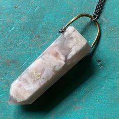 I recently sourced some beautiful crystals and stones so that we could make some more unique Taliswoman necklaces!This listing is for a lovely Cherry Blossom Agate, measuring 2 1/8" tall and 3/4" wide at the top of the stone, suspended from a brass bail with a 20" Sterling Silver chain. Cherry Blossom Agate is the stone of dreamers! If you are a person who is goal driven and has high hopes from life, then a Cherry Blossom Agate will keep you striving after them constantly! The rock is known to n Unique Quartz Crystal Necklace With Gemstone, Unique Quartz Crystal Necklaces With Natural Stones, Unique Mineral Crystal Pendant, Unique Agate Pendant Crystal Necklace, Agate Necklaces With Natural Inclusions For Healing, Unique Agate Gemstone Crystal Necklaces, Unique Agate Gemstone Crystal Necklace, Unique Crystal Necklaces With Large Stone For Healing, Large Stone Pendant Crystal Necklace