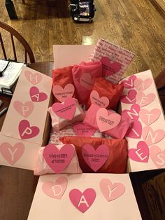 valentine's day cards in a box on the table