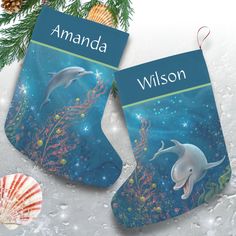 two personalized christmas stockings with dolphins on them