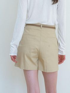 This is a feminine and minimal pants by Laminez that is made out of high quality and sturdy material. With distinctive mood of the design and comfortable wear, you can style it for your refined daily outfit.- Sturdy cotton fabric and standard fit- Clean pin tuck detail- Modern and feminine mood Chic Cotton Bottoms With Built-in Shorts, Beige Wide Leg Bottoms With Built-in Shorts, Chic Neutral Cotton Shorts, Modern Cotton Bottoms For Work, Cotton Shorts With Belt Loops, Elegant Cotton Shorts With Pockets, Classic Cotton Bottoms For Day Out, Chic Taupe Bottoms, Beige Linen Shorts For Work