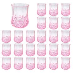 a set of twelve pink glass vases and cups with floral designs on the bottom