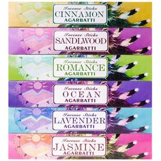 four different labels with feathers on them, one for lemon and the other for lavender