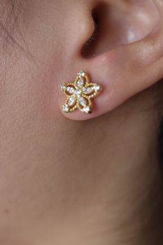 Magda Floral Gold Vermeil Lab Diamond Earrings are dainty, sparkly and romantic. Perfect for everyday. ◊ 18K Gold Vermeil ◊ Hallmarked S925 ◊ Measures approximately 12 mm width + height ◊ Lab diamond ◊ Pushback closure ◊ Sold as a pair ◊ Delivered in our beautiful Pina Blue box, perfect for gifting! SAY HI TO US Instagram: @thepinablue Pinterest: https://www.pinterest.com/thepinablue Facebook: https://www.facebook.com/thepinablue/ #pinablue Formal Gold Flower Cluster Earrings, Flower-shaped Sparkling Stones Earrings For Wedding, Gold Flower Cluster Earrings For Wedding, Wedding Earrings With Sparkling Flower Stones, Flower Shaped Wedding Earrings With Sparkling Stones, Wedding Flower-shaped Earrings With Sparkling Stones, Gold Flower-shaped Cluster Earrings With Cubic Zirconia, Gold Flower-shaped Cubic Zirconia Cluster Earrings, Gold Cubic Zirconia Flower Cluster Earrings