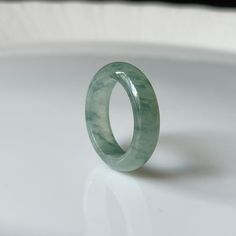 Untreated, Undyed, Authentic Natural Type A Burmese Jadeite Jade Handmade Band Ring ----------------------------------------------------- DETAIL SPECIFICATION ----------------------------------------------------- Inner Dia (內徑) : 17.1 mm (US size 6.75) Width (寬度) : 5.7 mm Thickness : 2.9 mm Weight : 3.5 g (17.5 ct) Color : Green Texture : Fine Transparency: Translucent Material : Fei Cui / Type A Jadeite jade/ Burma jadeite jade/ Natural Jadeite. Origin of Jade : Myanmar (Burma). ONLY ONE availa Modern Green Emerald Ring, Modern Jade Ring As A Gift, Green Jade Round Band Ring, Modern Green Round Band Jewelry, Classic Green Jade Jewelry, Green Jade Round Band Jewelry, Classic Round Jade Jewelry, Luxury Jade Rings, Classic Green Jade Rings