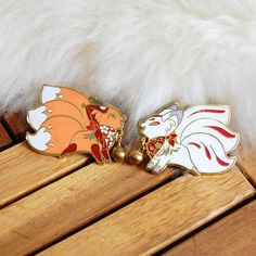 Queenie and Dawnsing are excite to make as much noise as possible! They are posed screaming at each other and each have a gold jingle bell on their neck. These pins are plated in gold and are about 2 x 1.25 inches in size. There are two clutches on the back of each fox to prevent spinning. Kitsune Spirit, Enamel Pin Collection, White Spirit, Anime Jewelry, Enamel Lapel Pin, Cool Pins, Jingle Bell, Pastel Floral, Metal Pins