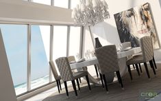 a dining room table with white chairs and a chandelier hanging from the ceiling