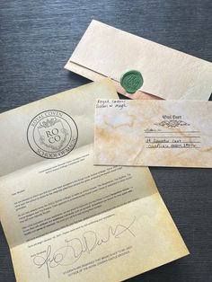 two old envelopes with wax stamp on them and one has a signed letter attached to it