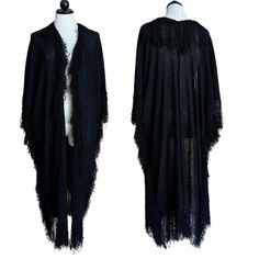 *French Rags* 80s boucle fringe knit duster 100% rayon.  Every piece I've ever had from this brand has been so cool and this is no exception! Amazing witchy piece in jet black knit - lightweight enough for spring and summer.  No marked size as it's a loose cut and stretchy knit - Looks great on everyone from a size 6 like my mannequin to a size 16 in modern sizes.  Fits Up to 50" bust . Length is 35" at center back seam. Plus 7" approx fringe length.  Flaw- small holes at center back near neck. Black Fringe Cardigan For Spring, Black Fringe Cardigan For Winter, Casual Black Fringed Cardigan, Casual Black Fringe Cardigan, Black Long Cardigan For Beach, Black Fringe Long Sleeve Cardigan, Black Long Sleeve Fringe Cardigan, Bohemian Black Knit Outerwear, Black Bohemian Knit Outerwear