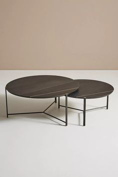 two coffee tables sitting on top of each other