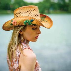 Woven raffia cowboy hat with colorful embroidered flowers. Curled up, shapeable brim, 3.5" wide. C-crown with pinched front. Vented weaving. Braided faux suede band. Inner band with drawstring to adjust fit. One size. Casual Hats For Western-themed Spring Events, Casual Spring Hats For Western-themed Events, Vintage Hats For Western-themed Summer Events, Southern Style Summer Hats For Western-themed Events, Multicolor Fedora With Curved Brim For Rodeo, Multicolor Flat Brim Straw Hat For Rodeo, Western-style Hat Bands For Spring Country Events, Flat Brim Hats For Western-themed Spring Events, Brown Sun Hat For Spring Rodeo