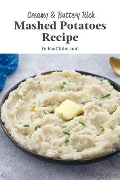 creamy and buttery rich mashed potatoes recipe in a black bowl with gold spoons