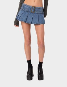 This Denim Mini Skirt Is The Ultimate Go-To Piece For All Your Spring/summer Plans. This Classic Staple With A Pleated Twist Will Go With Everything In Your Closet, So You'll Never Be Left Wondering What To Wear. Micro Skort. Pleated Design. Buckle Belt Detail. 100% Cotton. Item Care: Wash With Similar Colors. Model Wears Size S. Model Height Is 5'7. | Edikted Denim Pleated Skort Denim Pleated Skirt Outfit, London Fits, Skort Denim, Denim Pleated Skirt, Distressed Jean Skirt, Micro Skirt, Tennis Skirts, Miniskirt Outfits, Womens Tennis