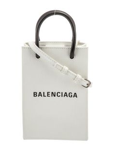 Balenciaga Shoulder BagFrom the Spring/Summer 2020 Collection by Demna GvasaliaWhite LeatherGraphic PrintGold-Tone HardwareRolled Handles & Single Adjustable Shoulder StrapCanvas LiningSnap Closure at TopIncludes Box & Dust BagUnfortunately, due to restrictions, this item may not be eligible for shipping in all areas. Chic Spring Bags With Logo, Casual Logo Bags For Spring, Spring Bags With Logo, Trendy Summer Bags With Logo, Casual Summer Bags With Logo, Mini Shopping Bag, Balenciaga Logo, Coach Horse And Carriage Tote, Home Logo