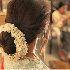 a woman with flowers in her hair