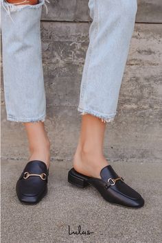 Step into quick style with the Lulus Ranae Black Slide-On Loafers! These cute mules have a squared toe, a notched collar, gold horsebit hardware, and an easy slide-on design. Low block heel lends just enough height to these chic loafer slides. 0. 5" wrapped block heel. Cushioned insole. Rubber sole has nonskid markings. Man made materials. Imported. Lulus | Ranae Black Slide-On Loafers. Chic Mules For Workwear With Round Toe, Classic Square Toe Mules For Office, Trendy Square Toe Mules For Workwear, Low Heel Mules With Buckle Closure For Work, Trendy Square Toe Mules For Work, Chic Mules For Workwear With Buckle Closure, Chic Horsebit Detail Slip-on Loafers, Casual Low Heel Mules For Office, Chic Loafers With Horsebit Detail And Round Toe