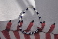 Show off your favorite team with one of these bracelets. Here I have New York Yankees made with White and Blue seeds beads, white plastic letters, beading wire, 1 Baseball bead, and a lobster clasp. If you need something different please email me. Thanks for your business! Please don't forget to like my shop. Yankees Bracelet, New York Yankees Bracelet, Team Bracelet, Sports Bracelet Sporty Blue Bracelets For Sports Events, Sporty Beaded Bracelets For Sports Events, Team Bracelets, Baseball Bracelet, Plastic Letters, New York Yankees Baseball, Sports Bracelet, Yankees Baseball, Spring Hill