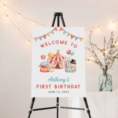 a welcome sign is displayed on an easel