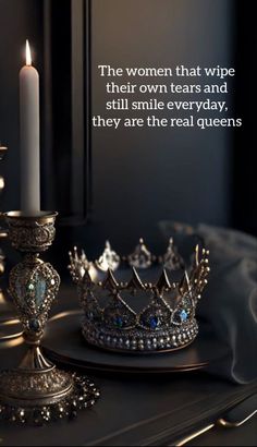 a crown and candle on a table with a quote about women that wipe their own tears and still smile everyday, they are the real queens