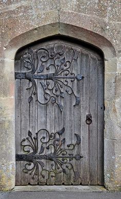 an old wooden door with intricate carvings on it's sides and the words written in arabic