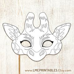 a giraffe mask that is on top of a wooden surface with the words printable